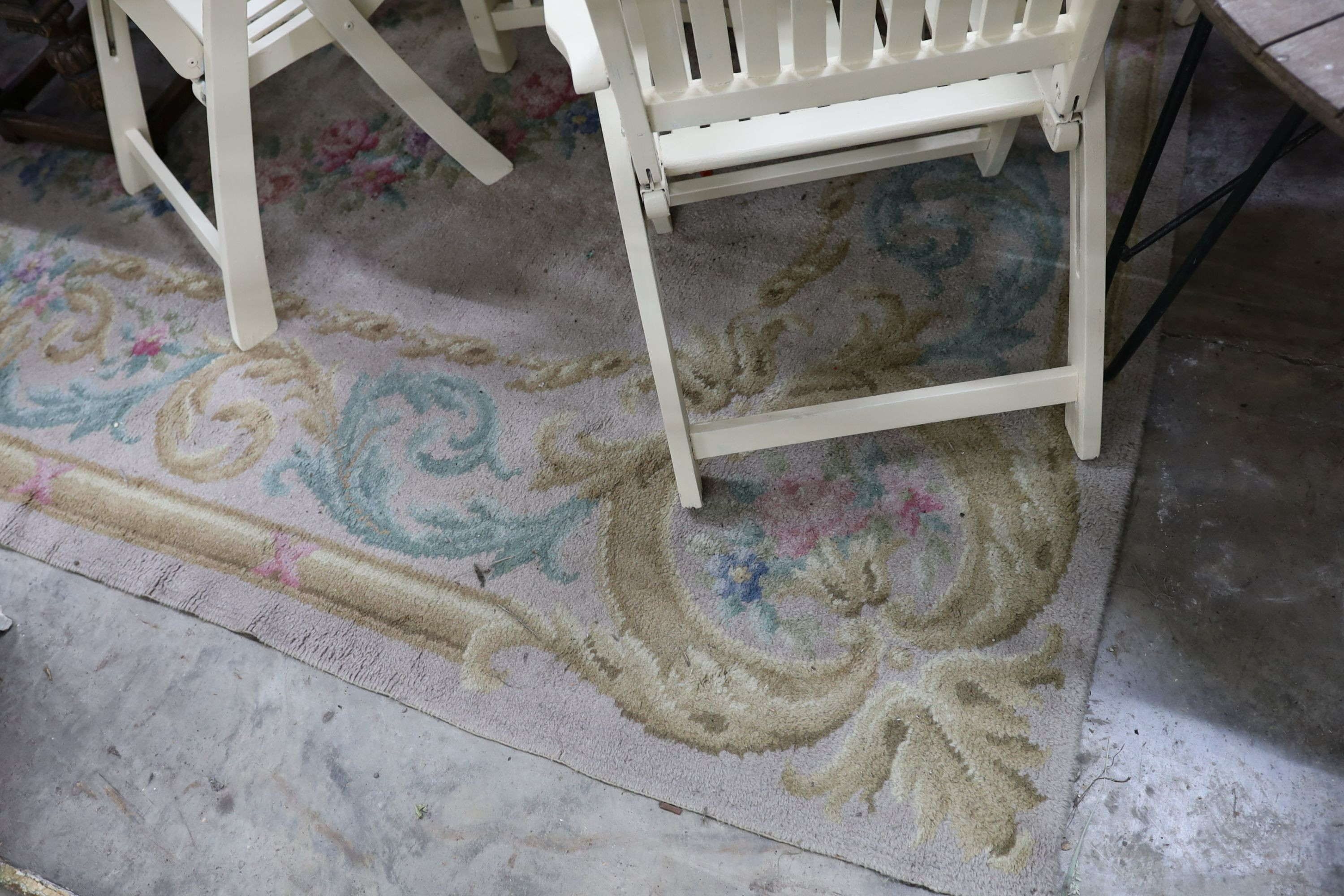 An Aubusson style fawn ground wool carpet, 360 x 260cm